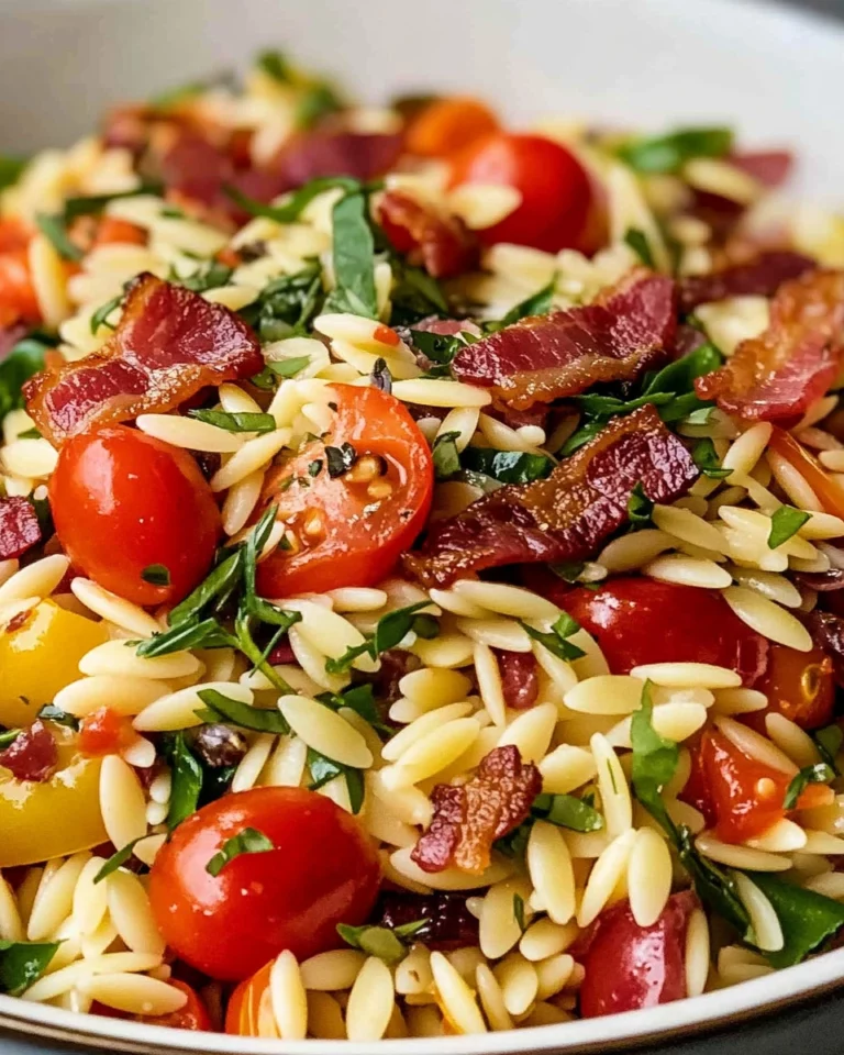 Italian orzo salad with crispy salami bits in a colorful bowl