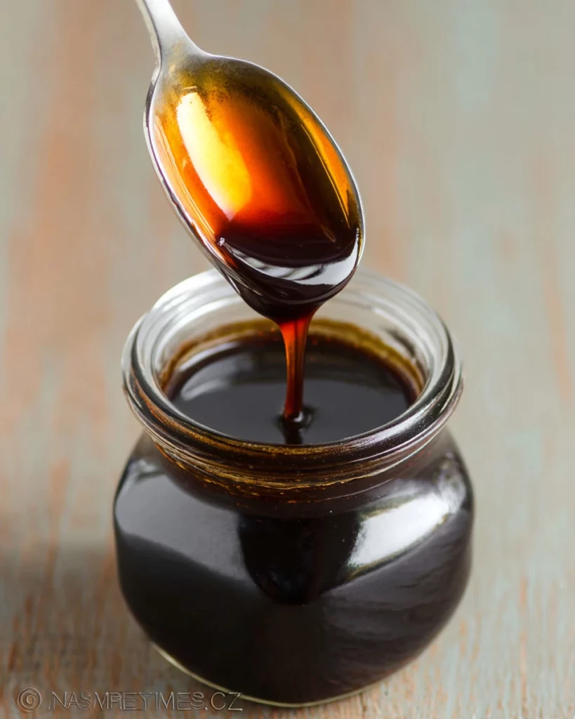 Homemade easy balsamic glaze drizzled over a salad