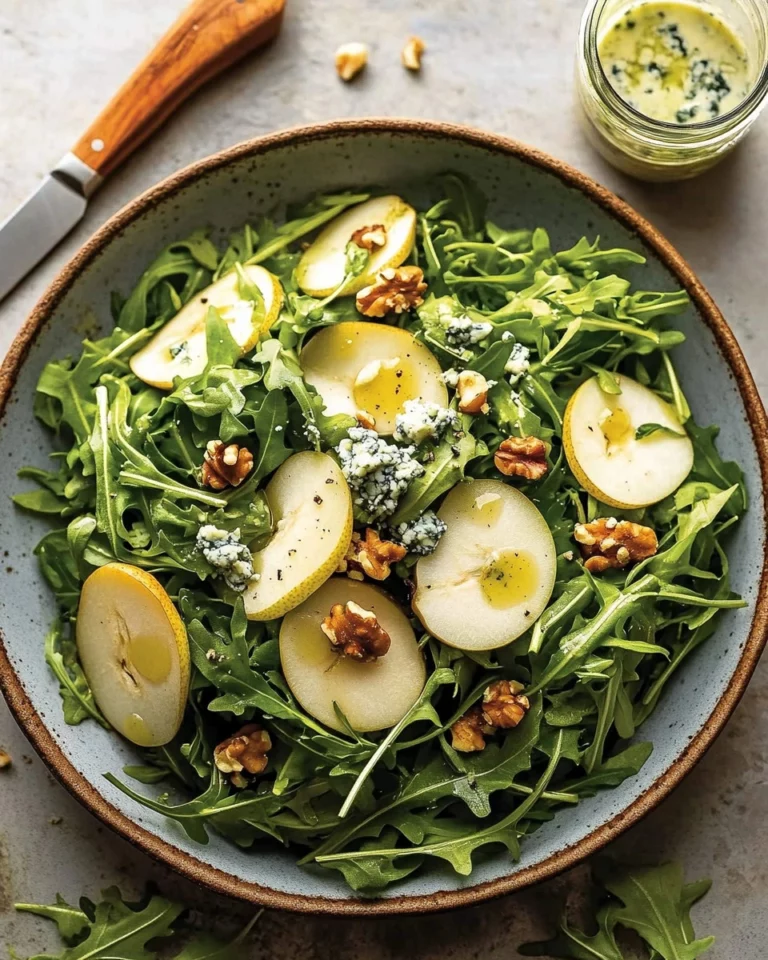 Delicious pear salad topped with blue cheese and fresh rocket leaves