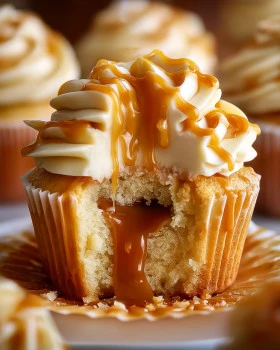 Delicious salted caramel cupcakes topped with creamy frosting and caramel drizzle.