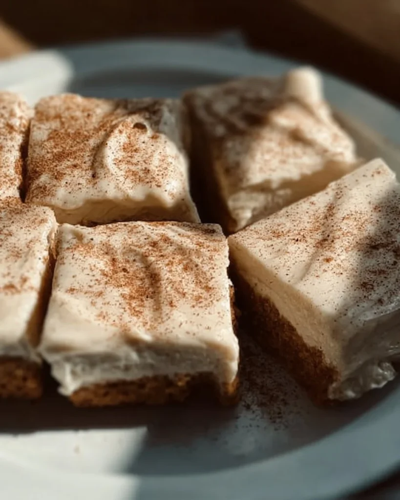 Delicious Apple Cinnamon Blondies topped with Maple Cream Cheese Frosting