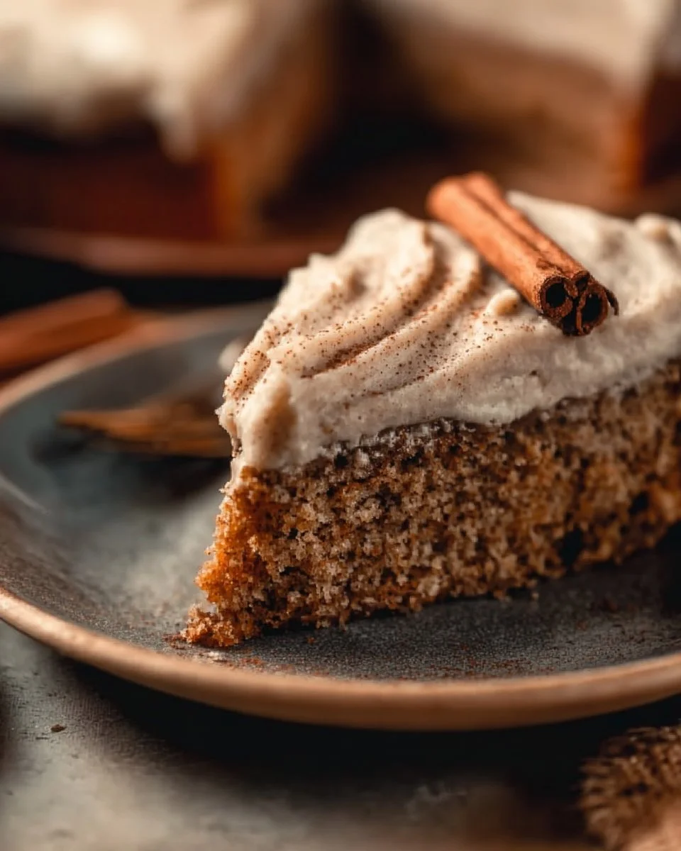 Sliced chai cake topped with spices and a warm glaze.