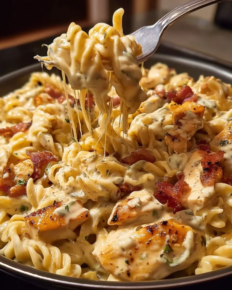 Creamy Chicken Bacon Ranch Pasta topped with crispy bacon and herbs