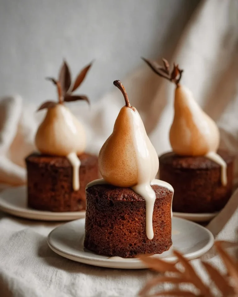 Poached pear cardamom cakes on a decorative plate