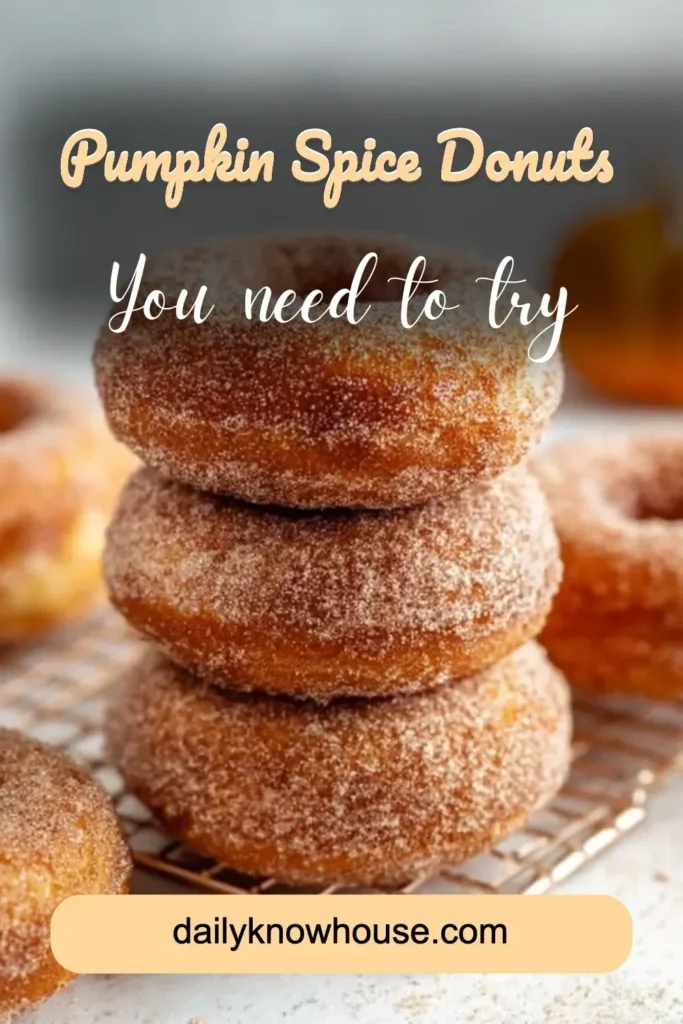 Freshly baked Pumpkin Spice Donuts with icing on a rustic plate