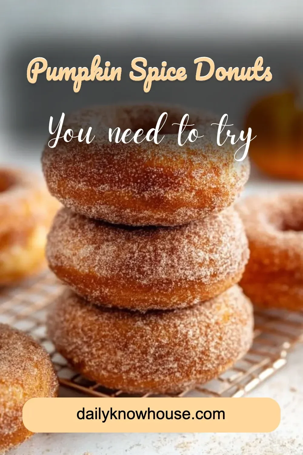 Freshly baked Pumpkin Spice Donuts with icing on a rustic plate
