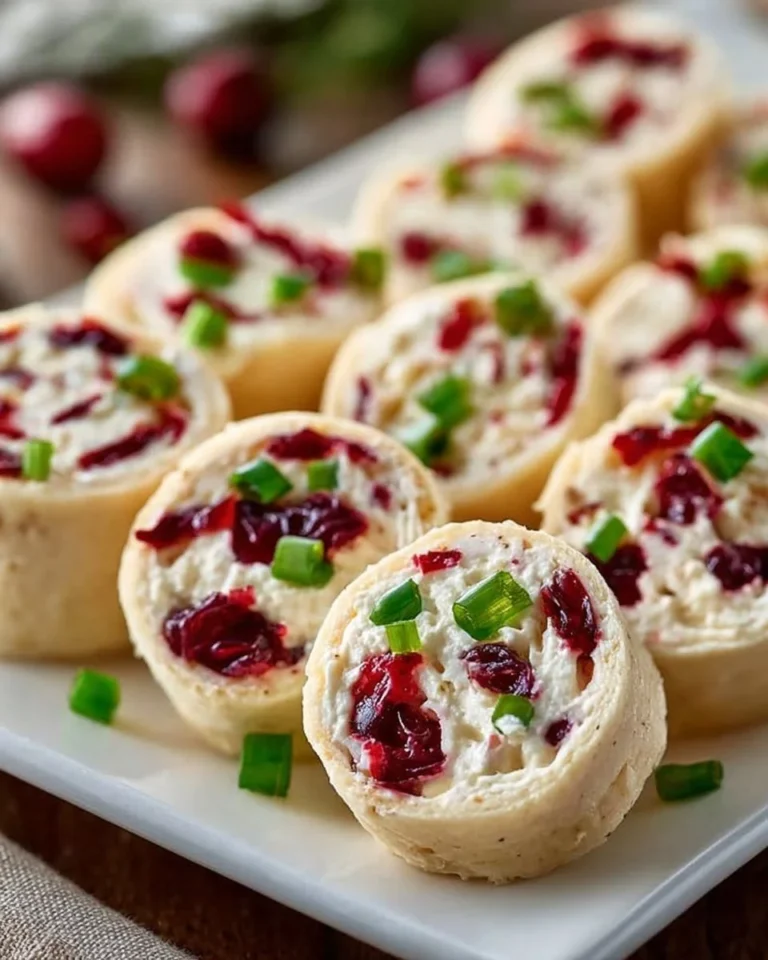 Festive Christmas Cranberry Roll Ups on a serving platter