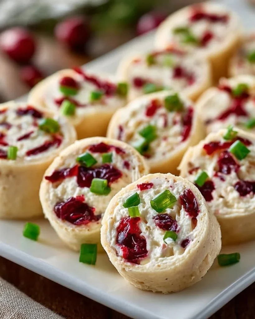 Festive Christmas Cranberry Roll Ups on a serving platter