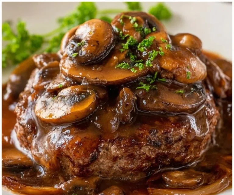 Homemade Salisbury Steak served with gravy and mashed potatoes