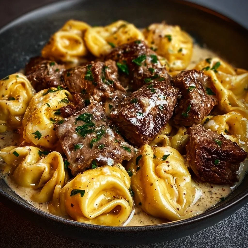 Cracked Garlic Steak Tortellini in Creamhouse Sauce served in a bowl