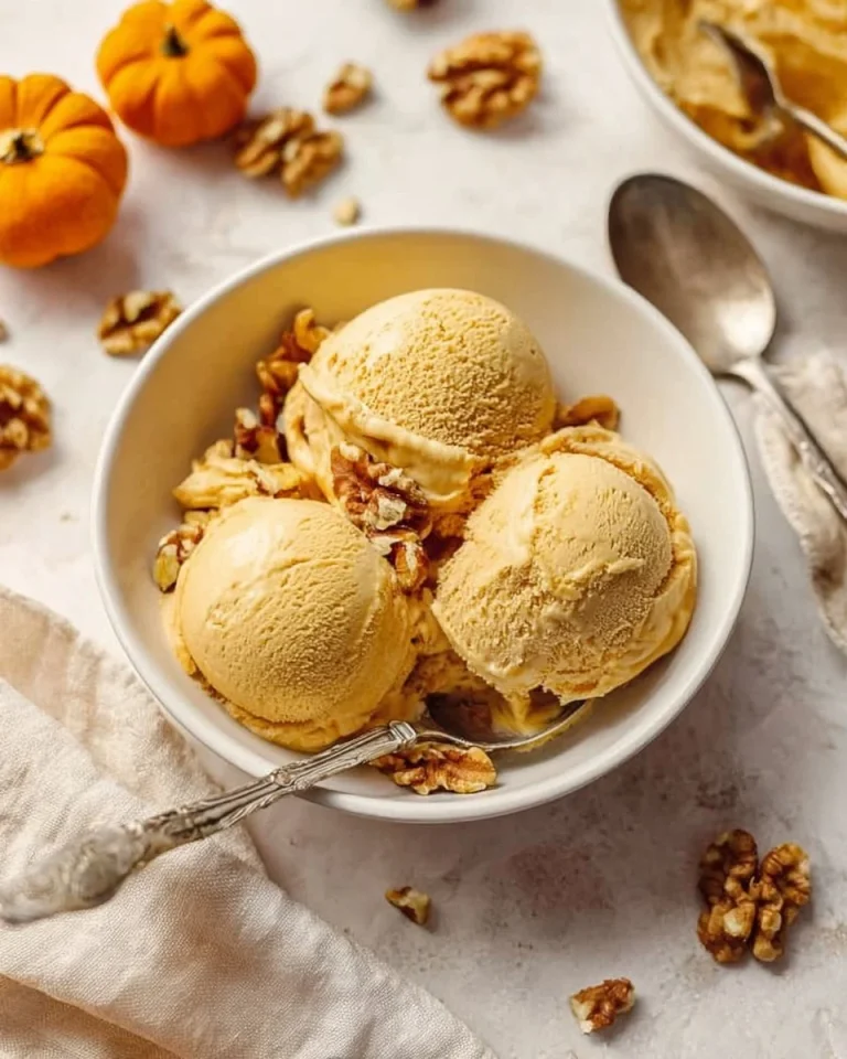 Bowl of no-churn pumpkin pie ice cream topped with spices
