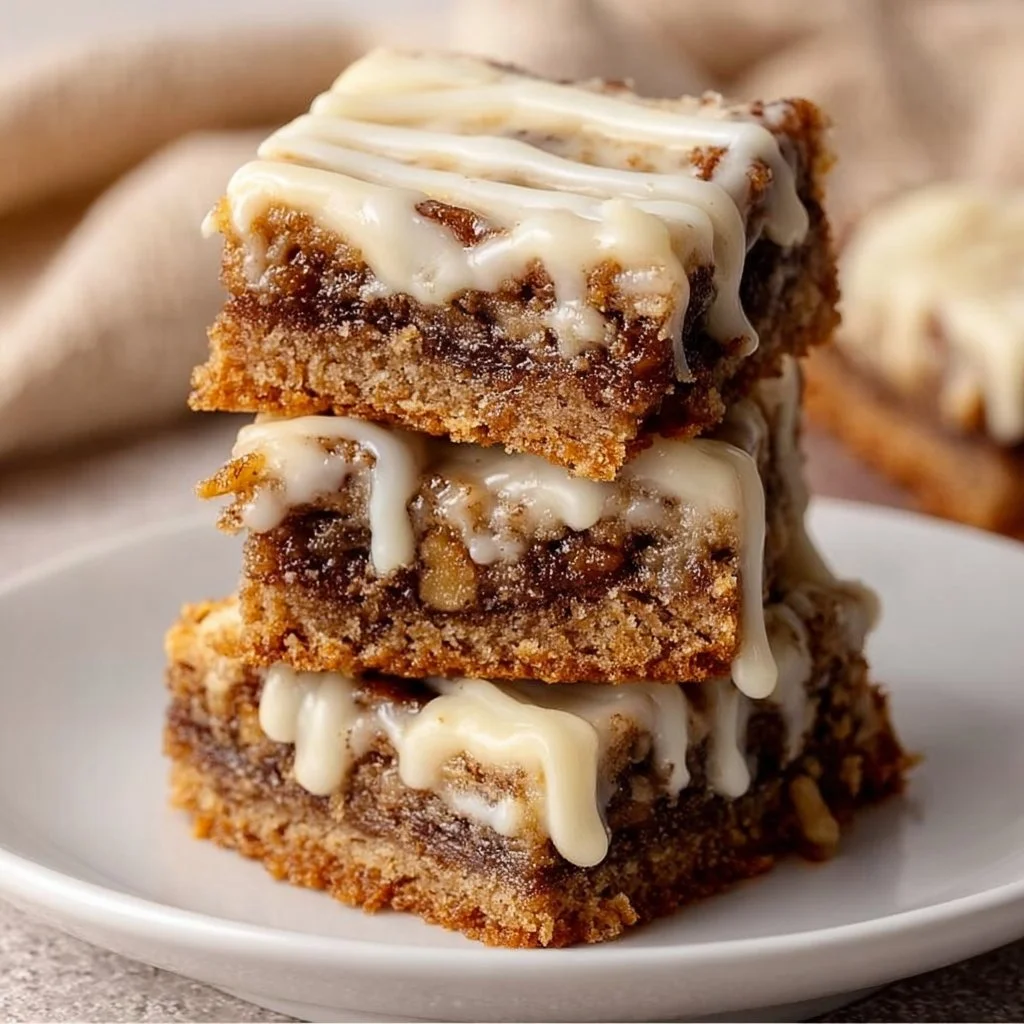 Cinnamon Roll Bliss Bars with creamy frosting and a sprinkle of cinnamon